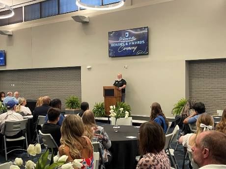 JCC staff giving a presentation at the honors and awards ceremony