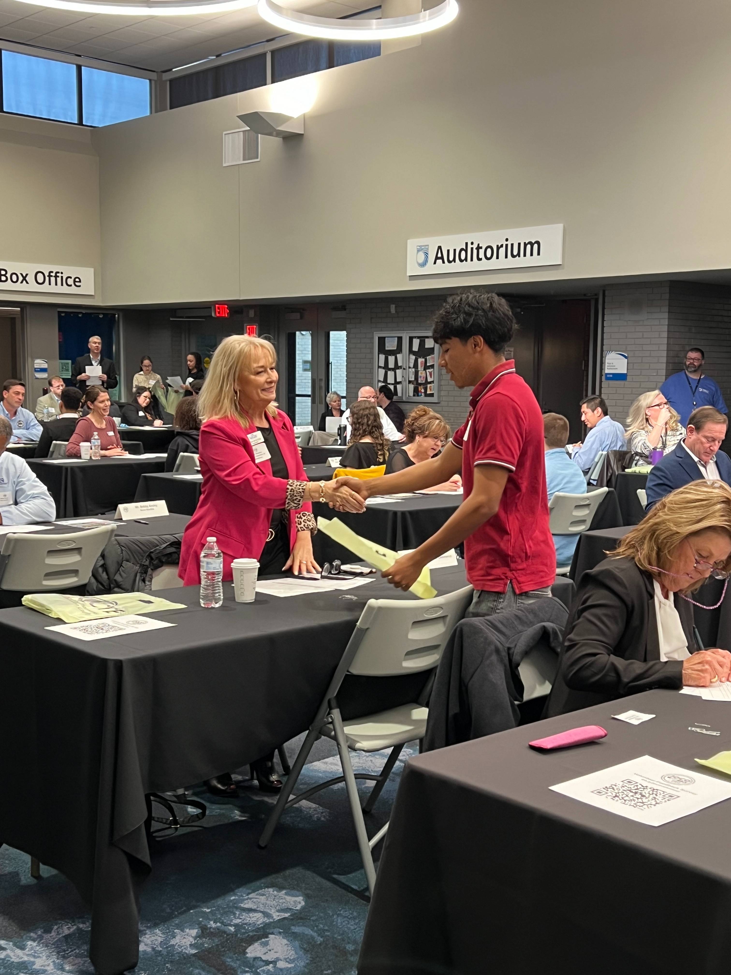 Johnston County work student shaking hands with professional interviewer 