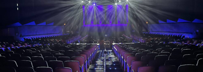 Paul A. Johnston Auditorium with beams of light