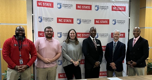 Photo of Wolfpack team and JCC Team at signing