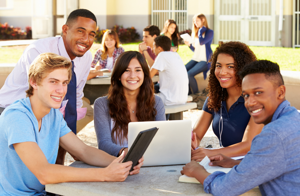 Photo of Students around a computer