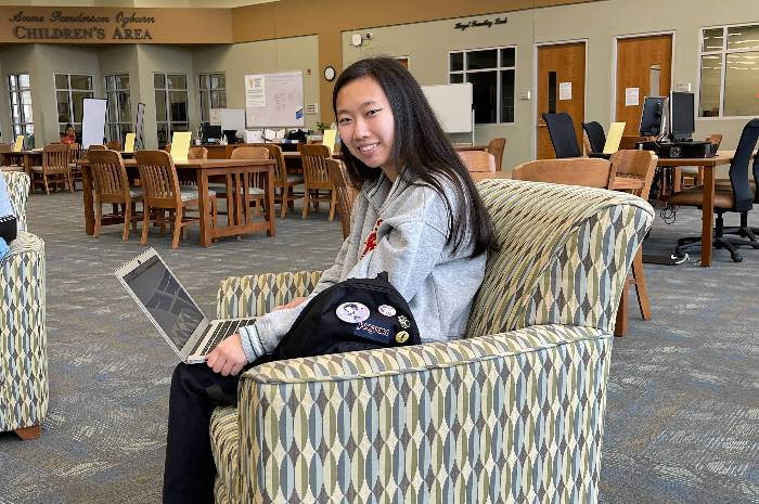 Student at computer in library