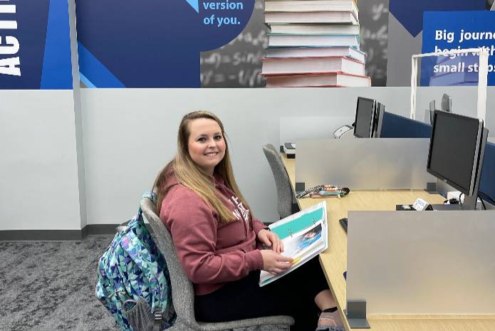 Female student sitting at desk in Student Success Center